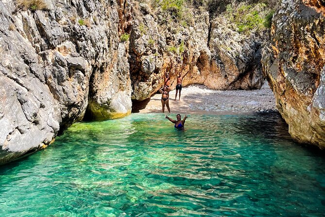Blue Cave & Grama Bay Full Day Guided Boat Tour - Llovizi Beach and the coast’s secretive side