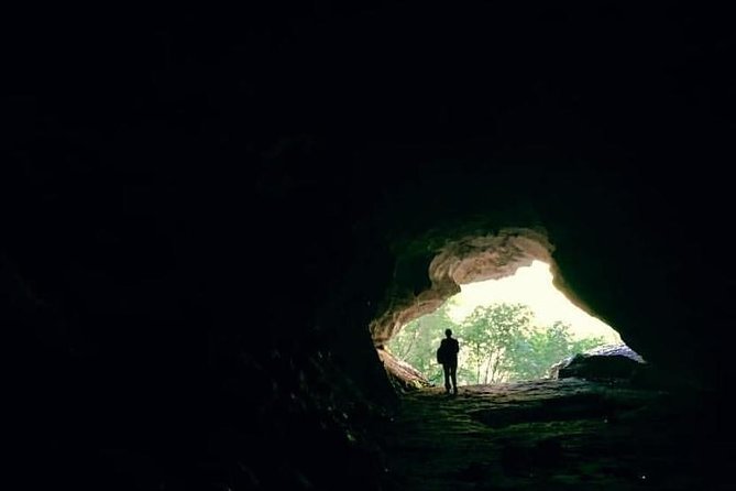 Cave of Pellumbas, Canyons & Castles hiking tour includes lunch - Inside Black Cave, with headlamps and slippery footing