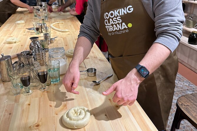 Traditional Albanian Cooking Class in Tirana with Raki Tasting - Preparing village chicken with pershesh